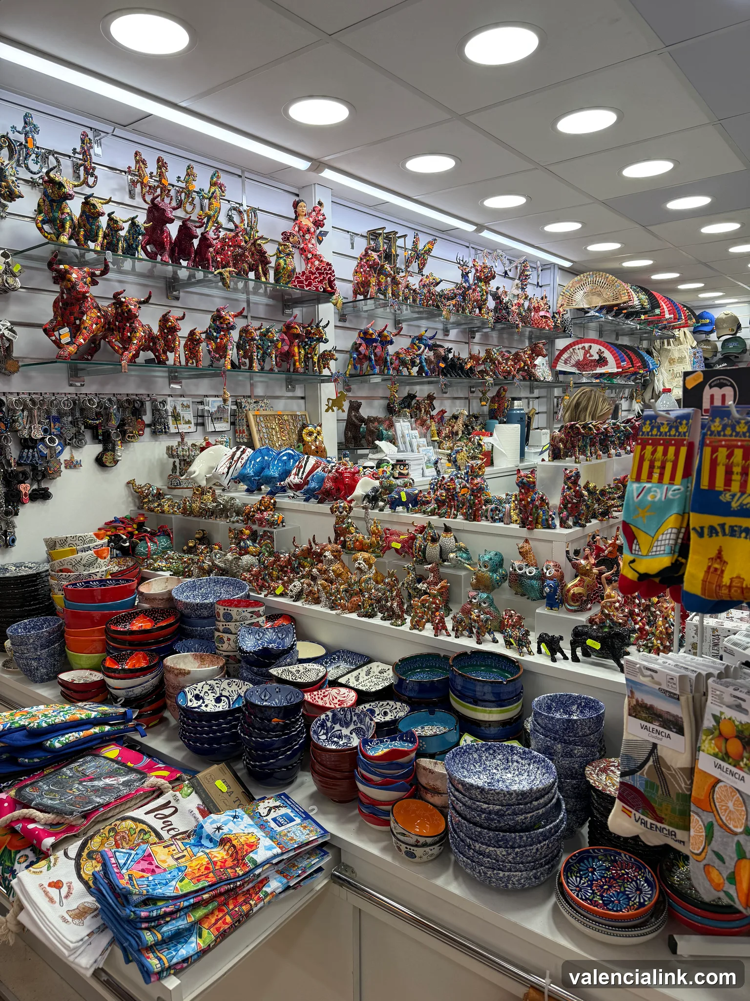 Store display with ceramic bowls and figurines.