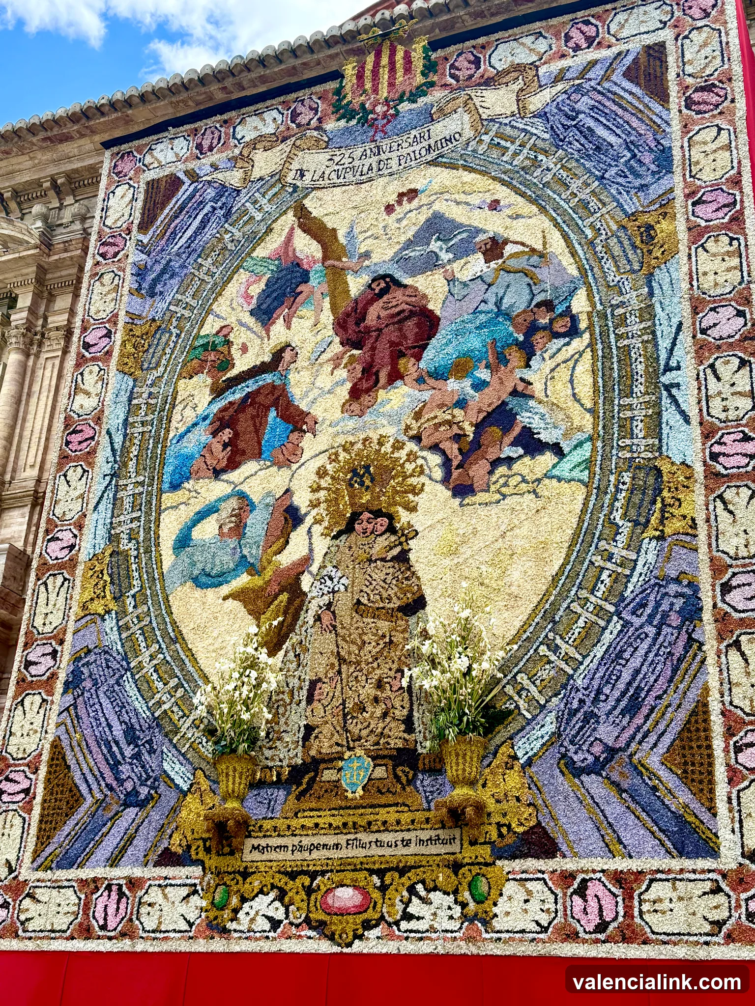 A vibrant mosaic featuring religious figures and floral arrangements.